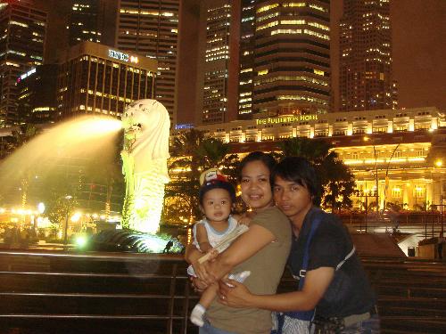 With the Merlion - This is our photo in Singapore with Singapore's icon, 'The Merlion'. Singapore is a beautiful place to spend a vacation.It's clean and have lots of shopping malls.