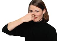 Bad Smells - A picture of a woman holding her nose closed.