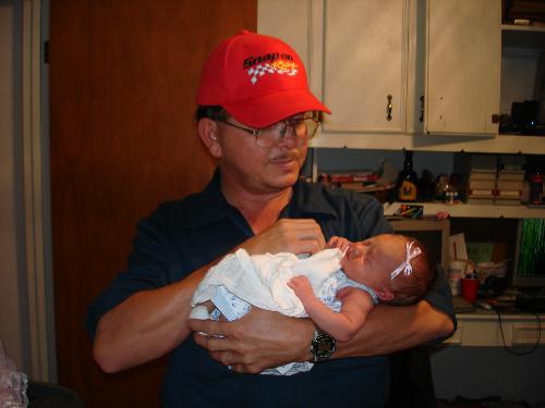 Proud new grandpa with our new granddaughter! - Our new granddaughter with her grandpa. She was in a hurry to get here because she came 9 days early. The proud mom's first baby didn't give any problems with the birth. Hey, I'm a grandma now!