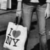 i love ny - an icon of a girl holding an i love ny shopping bag