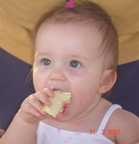 Maddie eating cake! - Maddie loves cake. She especially loved it on her 1st Birthday!