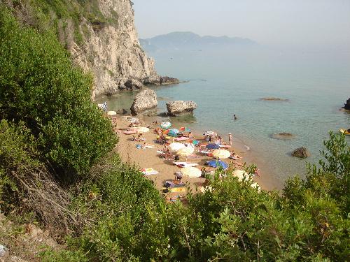 Nudist beach in Corfu - This is where I spent a lot of my time when I visited Corfu. Lovely people, very relaxed atmosphere. A little stream trickled down from the cliffs and a man would leave a bucket to fill up then trail the water along the beach to the sea so we could step on the sand. A great couple did greek yoghurt and fresh fruit plus fresh mango juice ina little shack. Heaven.