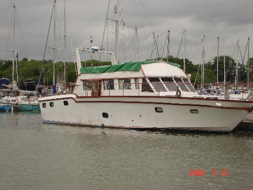 My home - This a 48 foot cruiser I live on. Life afloat is great. The tides rising and ebbing mean I have a changing view all the time. And if I get fed up I can just cast off the ropes and leave.