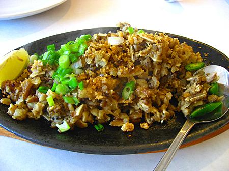 Sisig - Pig's face, ears and nose all chopped and mixed together. 