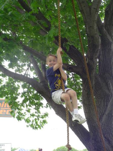 Scout Show - This is Shane. Shane is a Cub Scout. Cub Scouts like to climb. Shane loves to climb. Climb Shane climb. DON'T FALL! Taken on the obstacle course set up at the 2007 Scout Show.