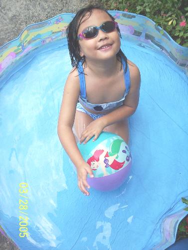 summer! - my daughter in the backyard soaking in the sun