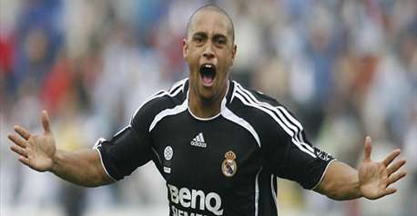 Roberto Carlos - Roberto Carlos celebrating after his goal ensured Real the 3 points!