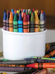 Crayons - A container of crayons for coloring.