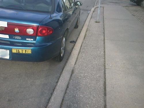 What The.... - This car was parked just outside of my back door, today. I smudged the licence plate to protect the identity of the vehicle owner.