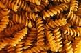 corkscrew pasta - picture of corkscrew pasta.  Uncooked pasta.  Pasta should be cooked in water then served to people who love pasta.
