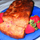 Strawberry Spice Loaf -  'This is a wonderful holiday bread! It's easy to make, very moist, and has lots of freshstrawberry flavor. Try it,you'll be glad you did.'   PREP TIME 15 Min  COOK TIME 1 Hr  READY IN 1 Hr 15 Min   INGREDIENTS: 3 cups all-purpose flour 2 cups white sugar 1 teaspoon salt 1 tablespoon ground cinnamon 1 teaspoon ground nutmeg 1 teaspoon baking soda 1 1/4 cups vegetable oil 4 eggs, beaten 2 (10 ounce) packages frozen strawberries, thawed   DIRECTIONS: 1. Preheat oven to 350 degrees F (175 degrees C). Grease and flour two 9x5 inch loaf pans. 2. In a large bowl, combine flour, sugar, salt, cinnamon, nutmeg and baking soda. In a separate bowl, combine oil and eggs. Add strawberries (juice and all) to oil/egg mixture. Mix thoroughly. Make a well in the center of the dry ingredients and pour in the strawberry mixture. Mix until thoroughly combined. Pour batter into prepared pans. 3. Bake in preheated oven for one hour, or until a toothpick inserted into the center of a loaf comes out clean. Cool slightly before removing from pans.