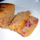 Whole Wheat Banana Strawberry Loaf -  'This is a recipe my whole family loves. It's a great breakfast bread. Enjoy!'   PREP TIME 15 Min  COOK TIME 	1 Hr 15 Min  READY IN 1 Hr 30 Min   INGREDIENTS: 2 cups whole wheat flour 1 teaspoon baking soda 2 eggs 5/8 cup vegetable oil, divided 1 1/2 cups white sugar 3 bananas, mashed 1 cup chopped strawberries 1 pinch ground cinnamon   DIRECTIONS: 1. Preheat oven to 350 degrees F (175 degrees C). Lightly grease and flour loaf pan. 2. In a large bowl combine flour, baking soda and cinnamon. Set aside. 3. In a medium bowl blend together with an electric mixer the oil, sugar, eggs and banana until well combined. 4. Add banana mix to the flour mix. Add the strawberries. Mix with a spoon until combined. Do not overmix. 5. Pour the mix into the loaf pan and bake at 350 degrees F (175 degrees C) for 1 hour and 15 minutes or until a toothpick inserted in the center comes out clean and the loaf is well browned. Note: Blueberries or chocolate chips are great in place of the strawberries.