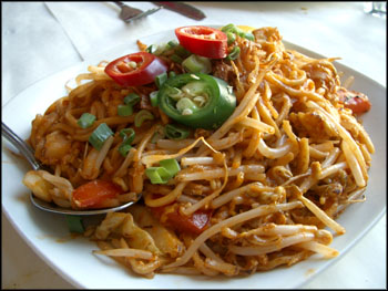 meegoreng - A delicious looking plate of mee goreng (fried noodles), complete with mega-sized slices of red and green chillies.