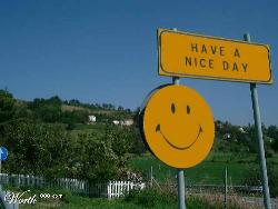Have a nice day!! - Have a nice day and smiley on a highway sign.