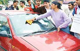 A human windscreen washer - How many times has this happened to you? You pull up at traffic lights only for someone to start cleaning your windows without your permission and then expected you to pay for it.