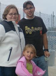 Our family - This is myself my hubby and his adorable daughter!  Help us keep a smile on her face!