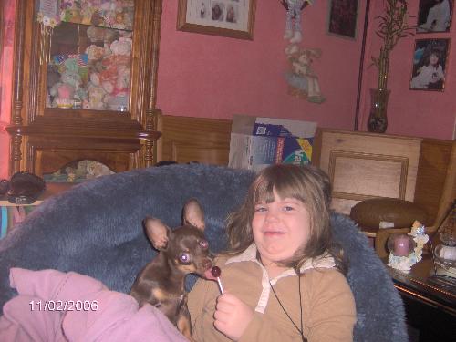 selena giving dog a halloween treat - selena and diego
