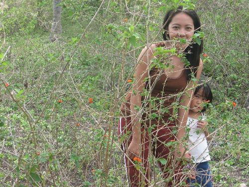 My cousin and me  - Playing hide and seek but caught and my naughty sis took a pic of us.