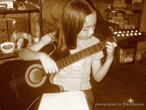 Sister - A pic of my youngest sis playing her guitar