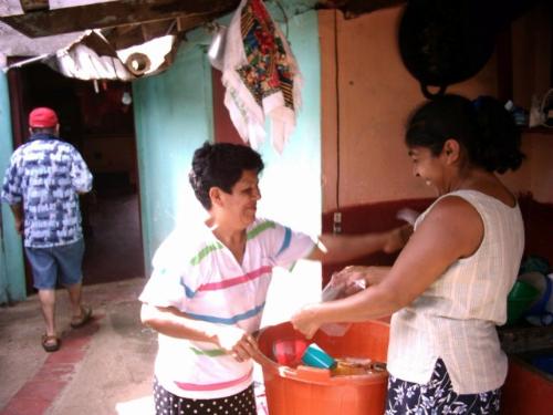 Making fruit drinks - This is my sister-in-law and her friend making fruit drinks to sell.