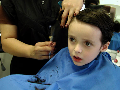 how much you shell out for doing this?? - A kid having his first haircut!