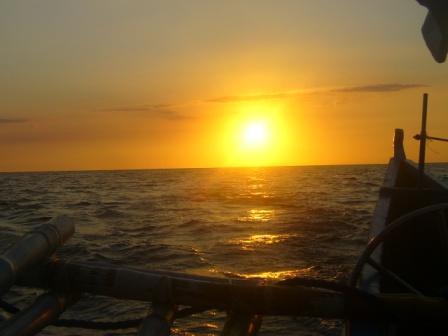 the sea, the banca and the setting sun - This was taken by my bestfriend in my primary years. I just love how the sea, the banca and the setting sun were put together in a picture.