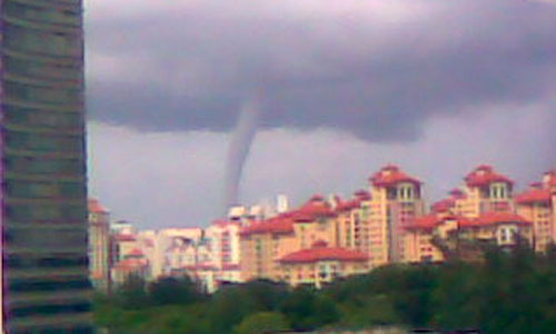 Mini tornado sighted in Singapore - A water spout has been sighted at about 2.40 am (singapore time) today (may 25) in the southern and eastern parts of singapore today.

In a country that is lucky not to have any natural calamities, this is the second sighting of such an event!
The first was on the island of Sentosa, spotted by a bunch of people partying on the beach a few months back.