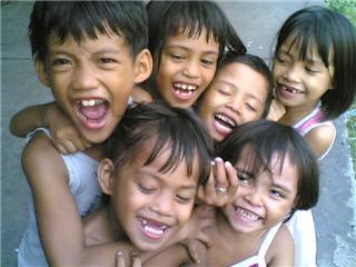 time to laugh - children living in 'riles' (train station) are happily living their dangerous lives...a slip of one foot can cos tthem their lives. A lost torn jacket may mean cold nights for the next few months...noisy as the trains that passes by - their lives are just as loud - lucky for them though, they are courageous enough to laugh at life's ironic twists of fate.