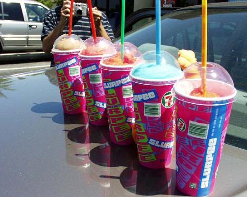 Row of Slurpees - This is a row of slurpees on the hood of a car.