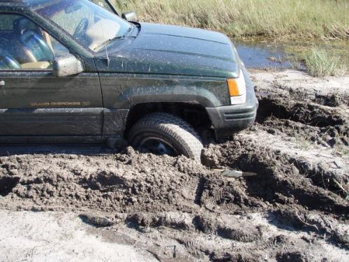 Close up of my jeep stuck - This shows how deeply my wheels dug into the slick mud.