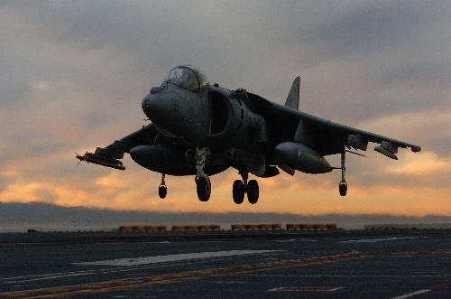 harrier - Harrier hovering over an aircraft carrier.