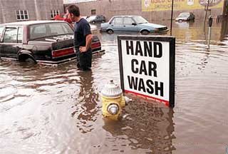 Car wash anyone? - Even though a flood is a serious businness that sign make this picture awsome!