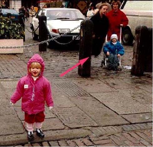 scary photos - was it real? A couple on vacation took a photo of their daughter, When the film was developed a lady without legs appeared...