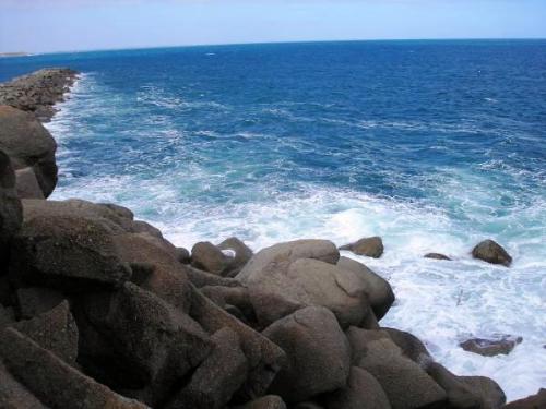 Ocean - A scenic view of a rocky port.