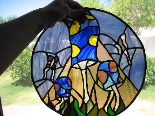 some stained glass i made - this was my first round project i made back in my senior year of high school...pretty groovy huh?
