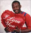 i love you - a person with an i love you pillow