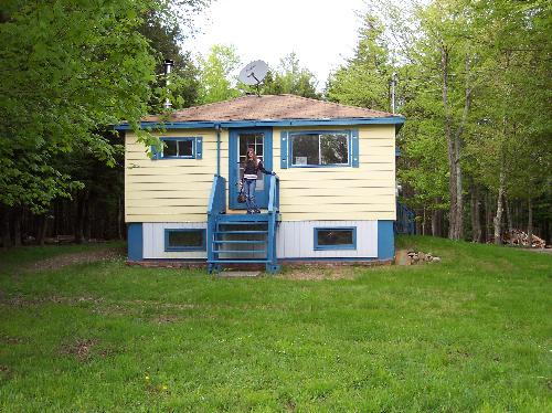 Small house - That's me standing on the front porch of the small house (800 square feet). Small house - That's me standing on the front porch of the small house (800 square feet).