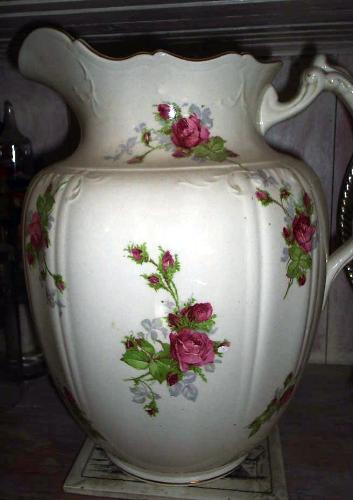 We love collecting - This is one of my favorite items. It is the pitcher part of a ladie's bathroom wash set. We also have the basin, both of which are in perfect condition and have been handed down through the family for generations.