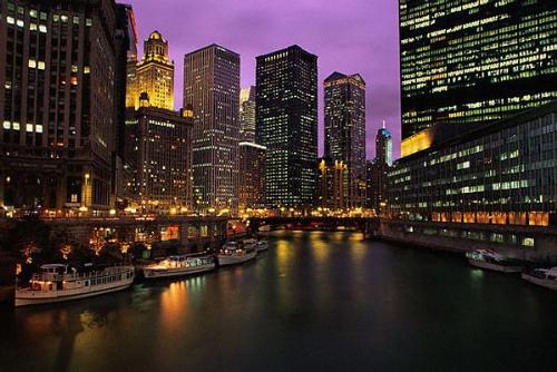 Cruise Boat - cruise boat under the bridges of the Chicago River at sunset.