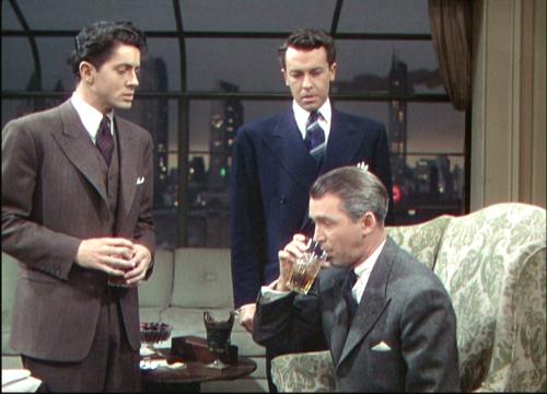 A scene from the Hitchcock thriller Rope - Rope is a classic Hitchcock thriller starring James Stewart. Synopsis: two young men kill prep-school friend, just for the thrill of it, and challenge themselves by inviting friends and family to their apartment afterward—with the body hidden on the premises. Hitchcock's first color film was shot in ten-minute takes to provide a seamless flow of movement, but it remains today what it was then: an interesting, highly theatrical experiment. Inspired by the real-life Leopold-Loeb murder case. Patrick Hamilton's play was adapted by Hume Cronyn and scripted by Arthur Laurents.