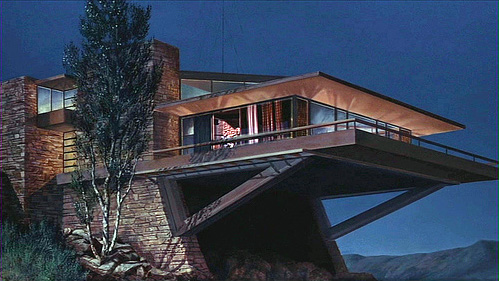 The house from North by Northwest  - North by Northwest is a popular Hitchcock film. Cary Grant plays a Manhattan advertising executive who's mistaken for a government agent. His attempts to clear up the misunderstanding only implicate him in a murder that makes him the target in a nationwide hunt. Forced on the run, he's faced at every turn by assassins out to kill him, and the mysterious Eva Marie Saint who's only too keen to help. Running at over two hours, Hitch is able to pack in many memorable sequences including the famous crop-dusting scene. While each of them excels in intrigue and suspense, he cleverly links them with black humour. Hitch delivers these emotional highs and lows with perfect timing, allowing moments of relief to break out before mounting another crescendo of excitement. The effect is like a grand musical work, conducted with bravura audience manipulation.