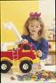 Gender roles.  - A young girl playing with a toy truck.