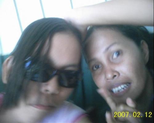 my sister and i - this sister is a really cool sister. she has a husband already but they dont have any children. they're living together happily. this pic was taken in our law school when i forced her to go with me to follow-up on something.