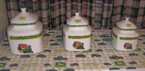 Cannister Set/John Deere Kitchen - This is a photo of the cannistr set that goes with the rest of my dishes all in the John Deer Tractor design...they sit on top of my chest style freezer....  I just love them.