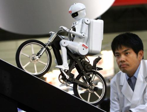 robot - robot riding on bike