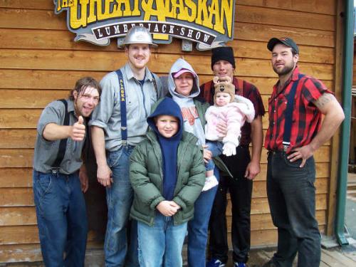 Us with the loggers at one of the shows - One of the shows, the logging show