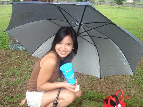 Chillin' - This was taken when we went to Forest Park Cemetery. It was kinda drizzling that day. I think that would speak for the umbrella. Hehehe.