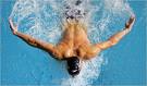 Swimming - A man swimming in a pool and he is enjoing swimming. Swimming - A man swimming in a pool and he is enjoing swimming.