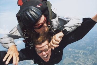 My First Tandem Skydive - This is me falling through the wild blue yonder after taking a leap from 13,000 feet! I wasn't to keen on having an old man strapped to my back, but he turned out to be pretty useful when it came to getting the parachute open! =) I look like I am screaming but I actually laughed most of the way down...I just couldn't believe what an unreal experience it was to fly OUTSIDE of an airplane! WOW!