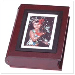 Hand Crafted Photo Album - Hand crafted from rich cherry wood, this distinctive photo album has 50 pages and can display up to 200 4" x 6" photos.